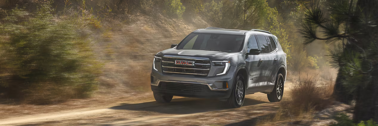 2025 GMC Acadia driving in Dover, OH