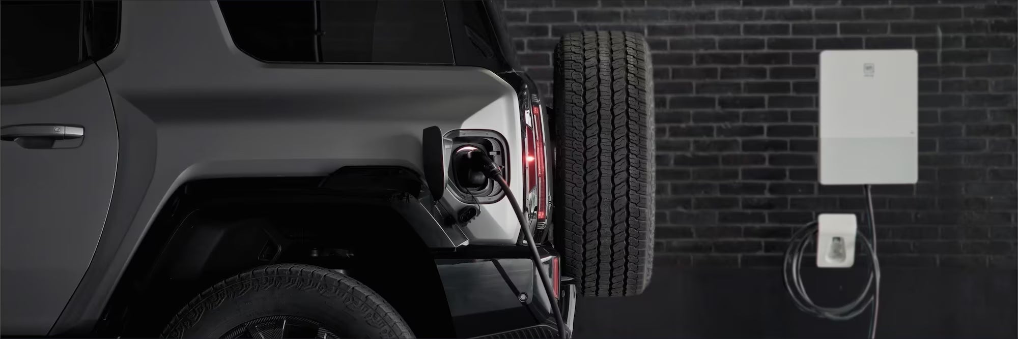 2026 GMC Hummer EV SUV charging near Canton