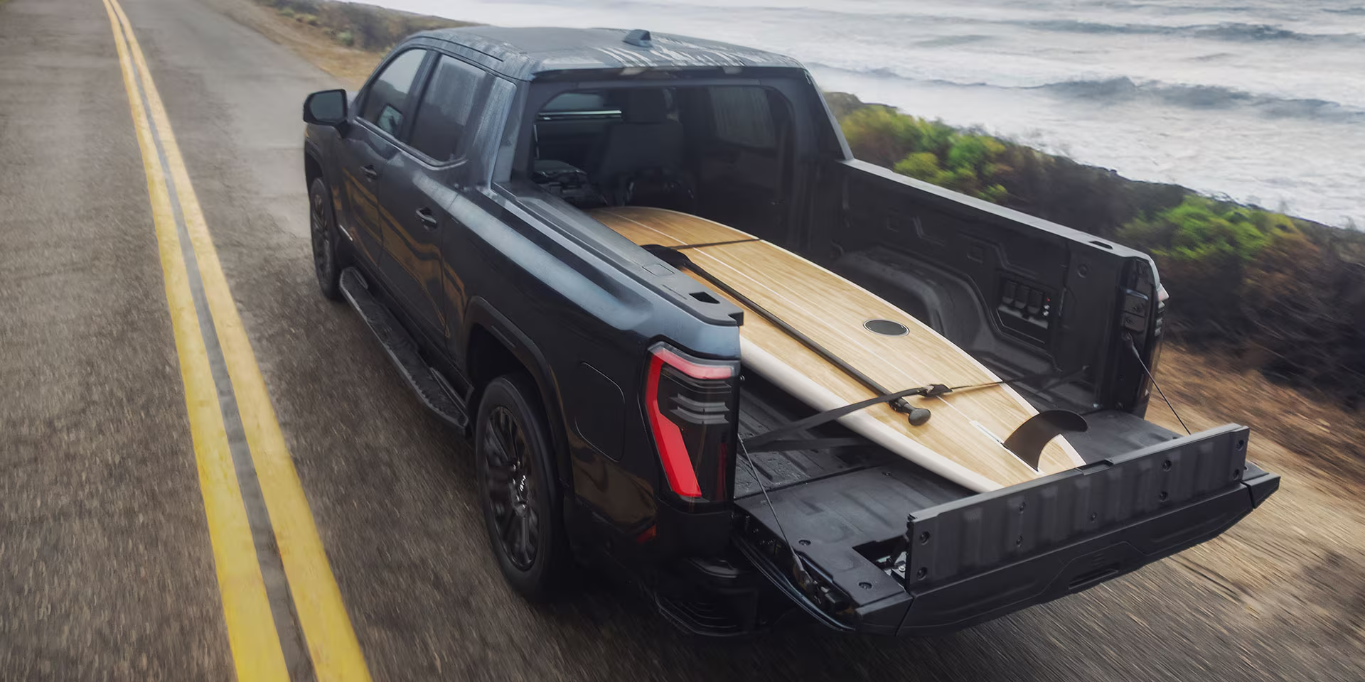 2026 GMC Sierra EV driving in Dover